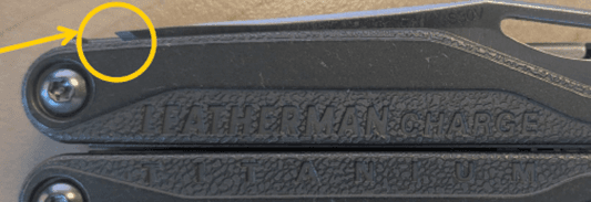 An exposed blade tip protruding from the handle