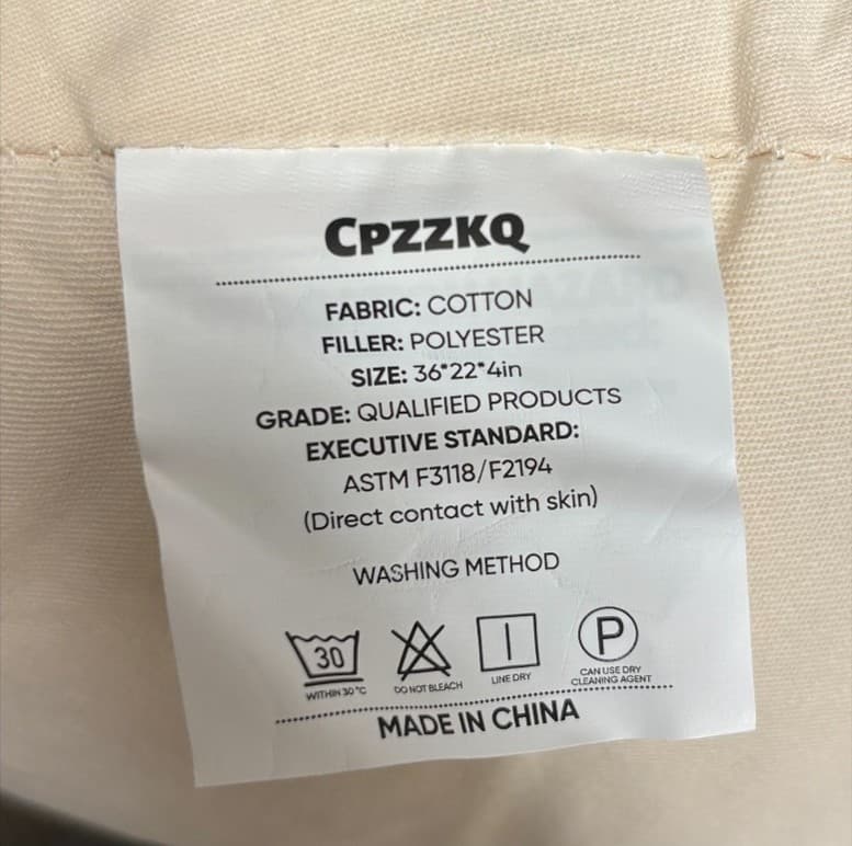 The brand is printed on a tag on the side of the recalled Cpzzkq baby loungers