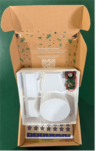 The delivery box's white tray of the recalled Autobrush Kids Sonic Pro Children's Toothbrush has a speaker with a coin cell battery on the underside