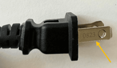 Date code etched on prong of recalled hair curling iron plug