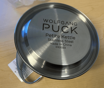 Wolfgang Puck Petite Kettle appears on the kettle's underside