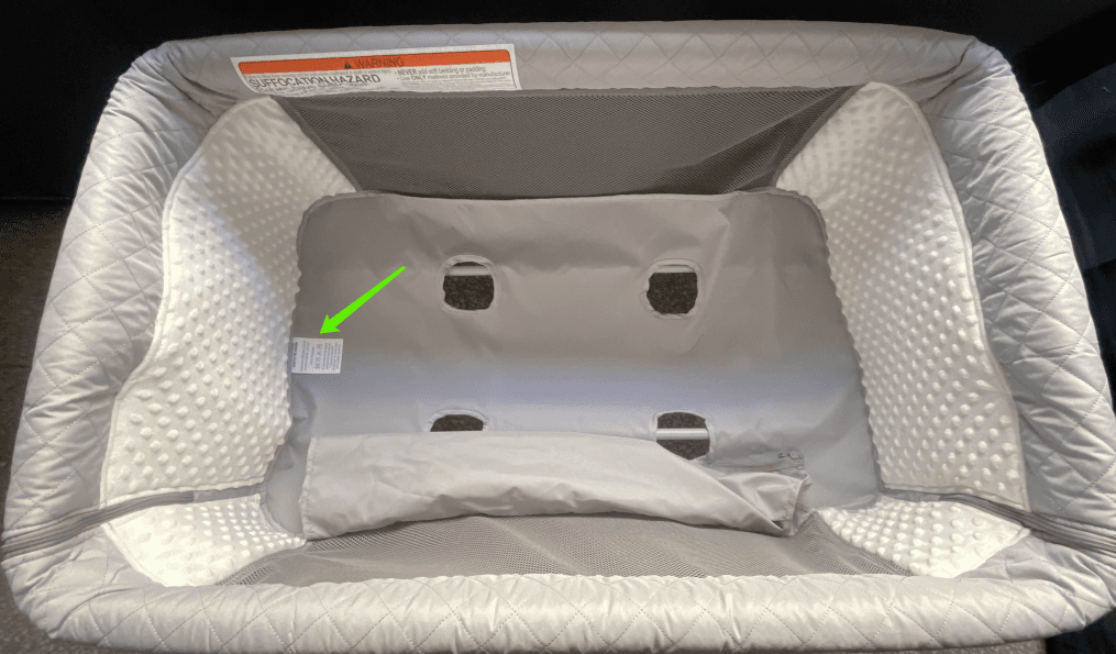 "Product Model: QX-831" is printed on a label located on bottom of the convertible bassinets underneath the mattress pad