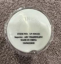 "ITEM NO: LP-024 (122)" and "Importer: ABC Trading, Inc" are printed on a label on the underside of the recalled shot glasses